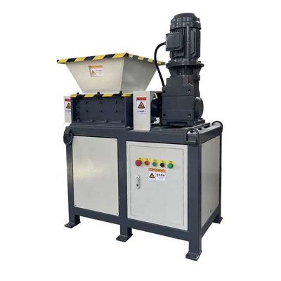 Machine à déchiqueter les déchets métalliques et textiles